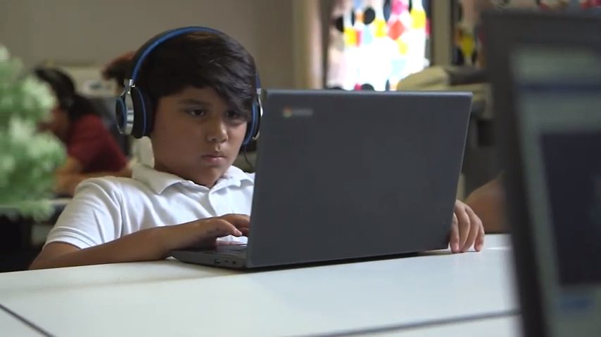 A student works on a computer.