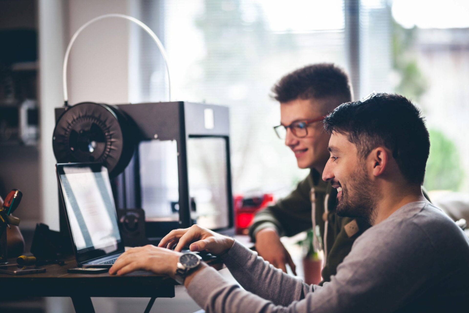 Instructor helping students on electronic course