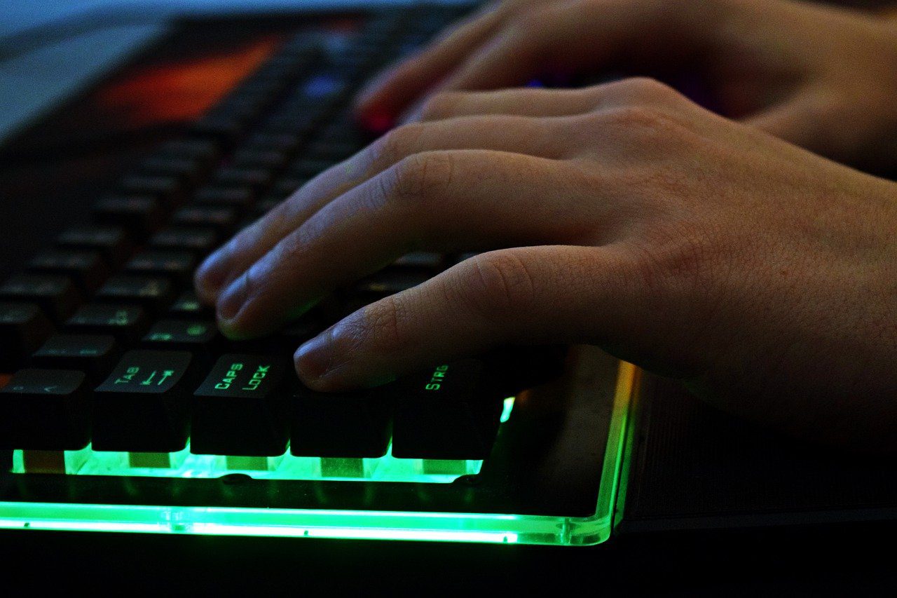 Image of hands typing on a keyboard.