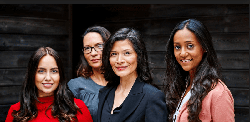 Image of four diverse women looking at the camera